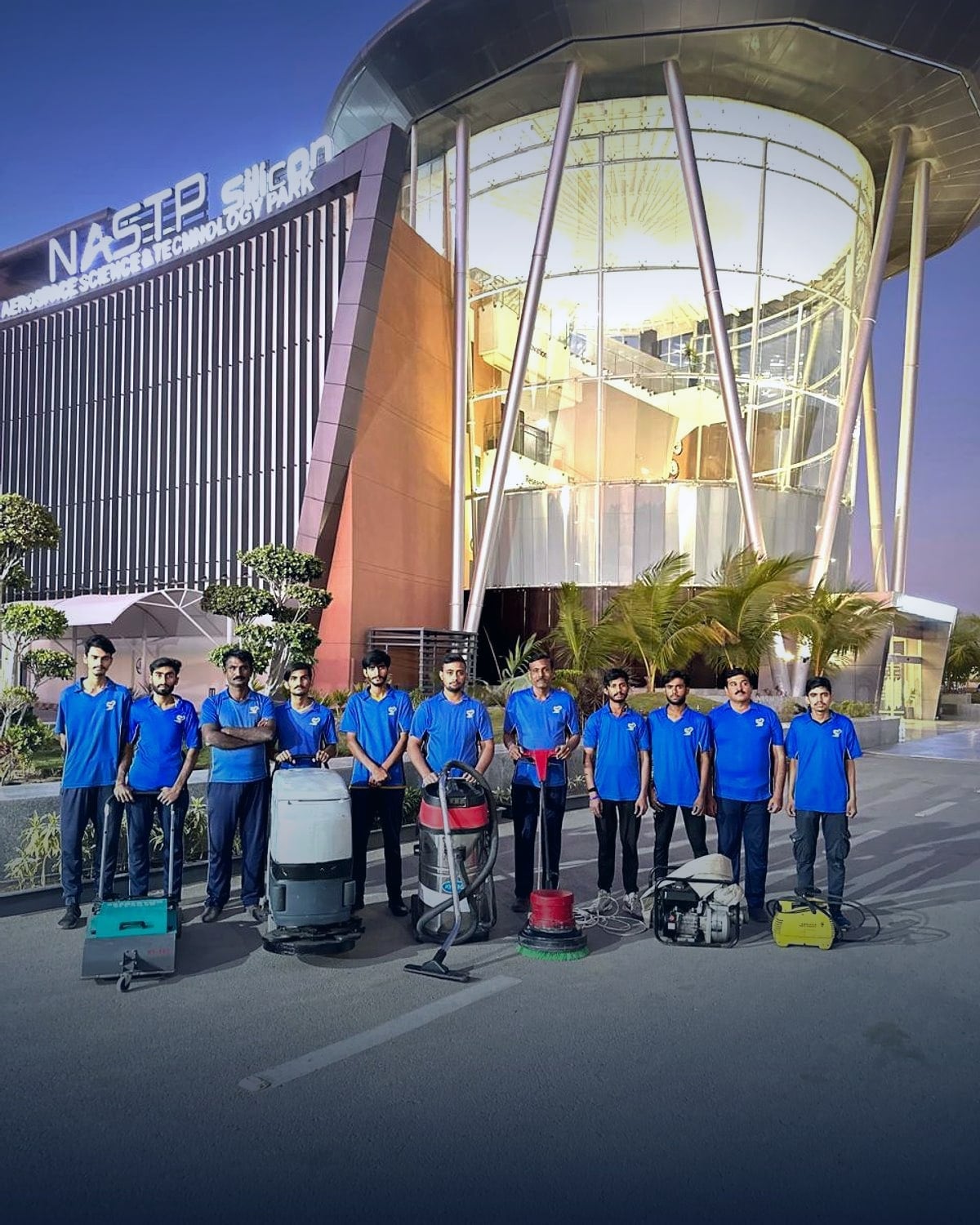 The Swift Solution operations team with scrubbers, extractors and burnishing machines outside NASTP Silicon Valley, Karachi